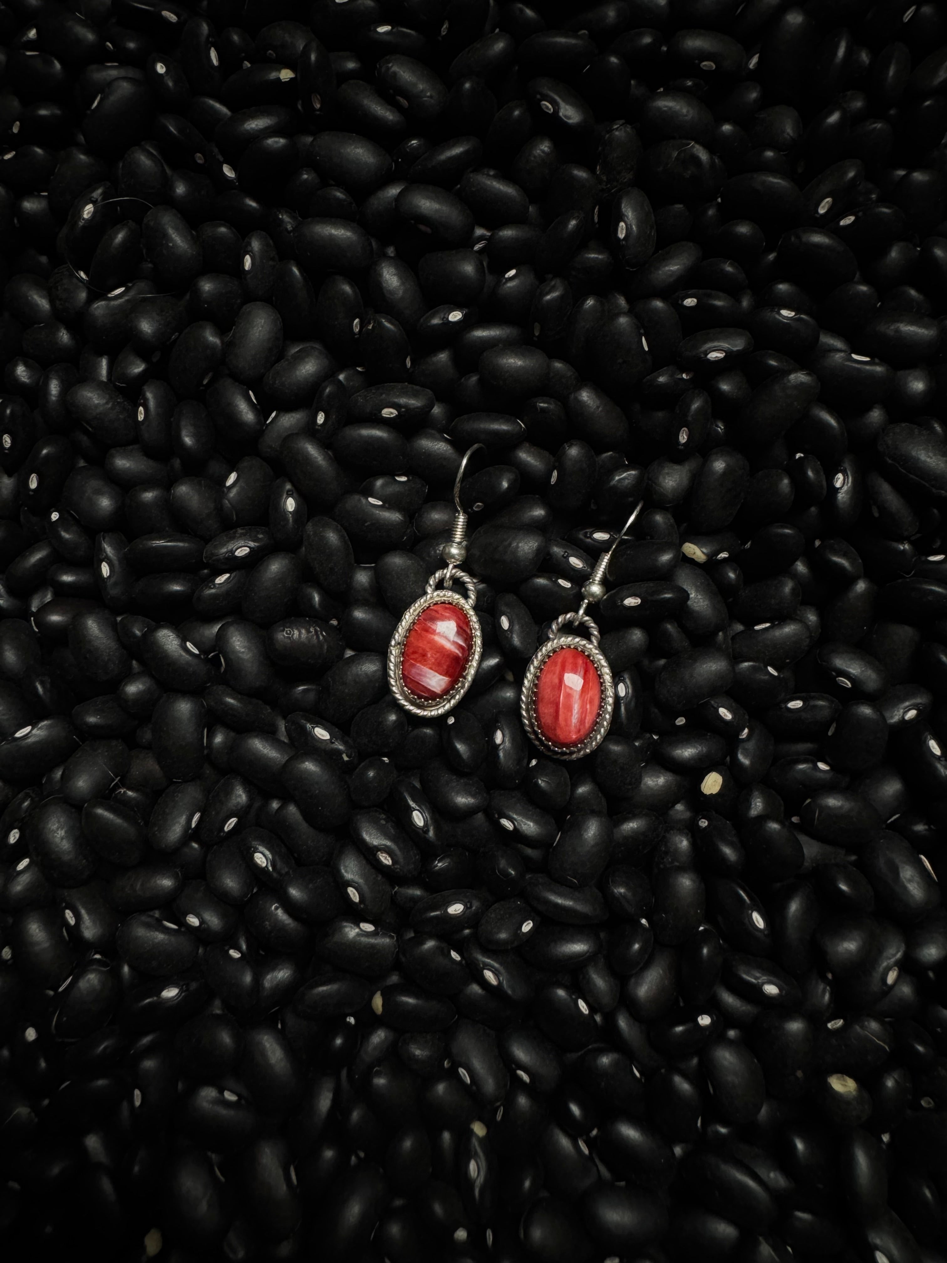 Red spine stud earrings