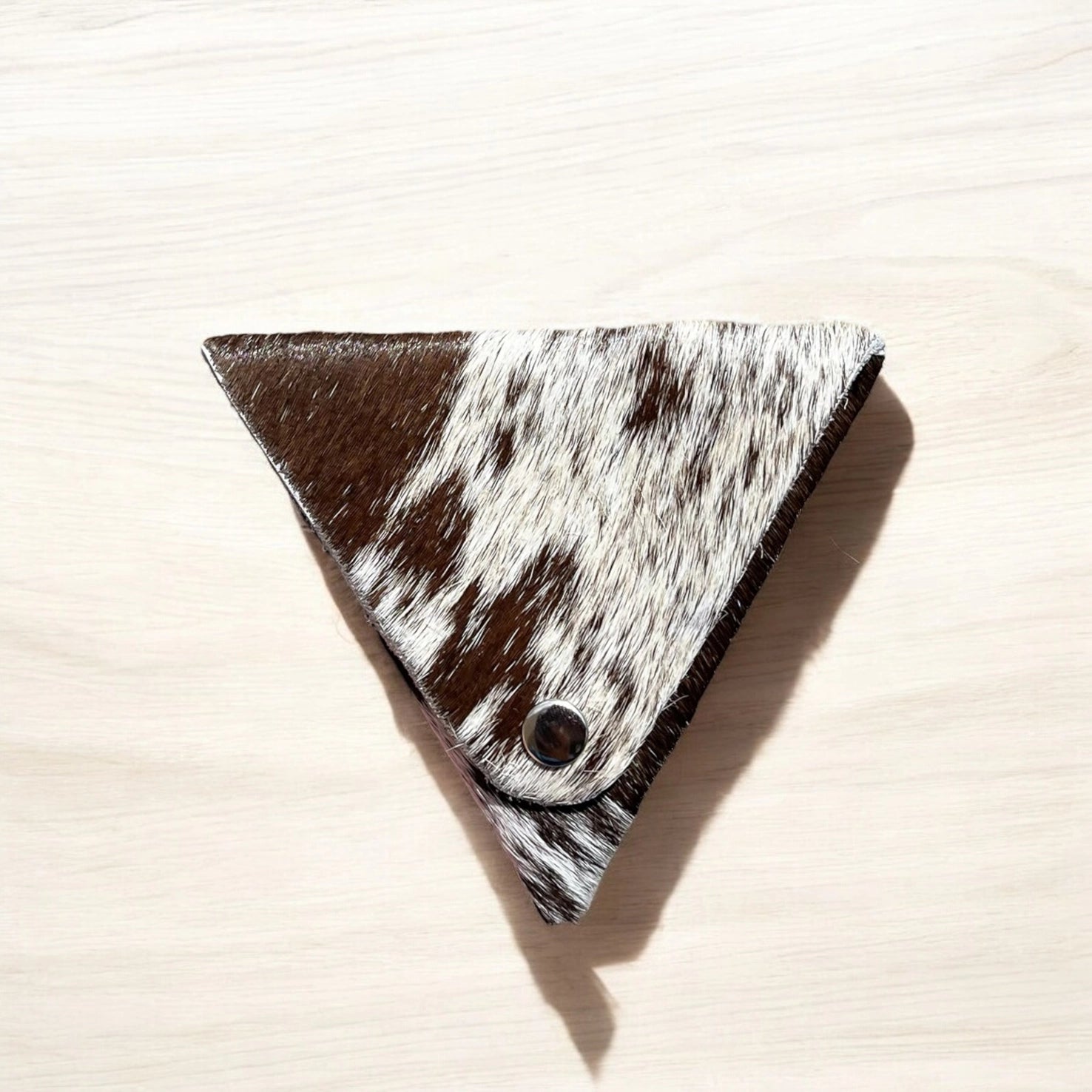 Brown cowhide triangle jewelry pouch