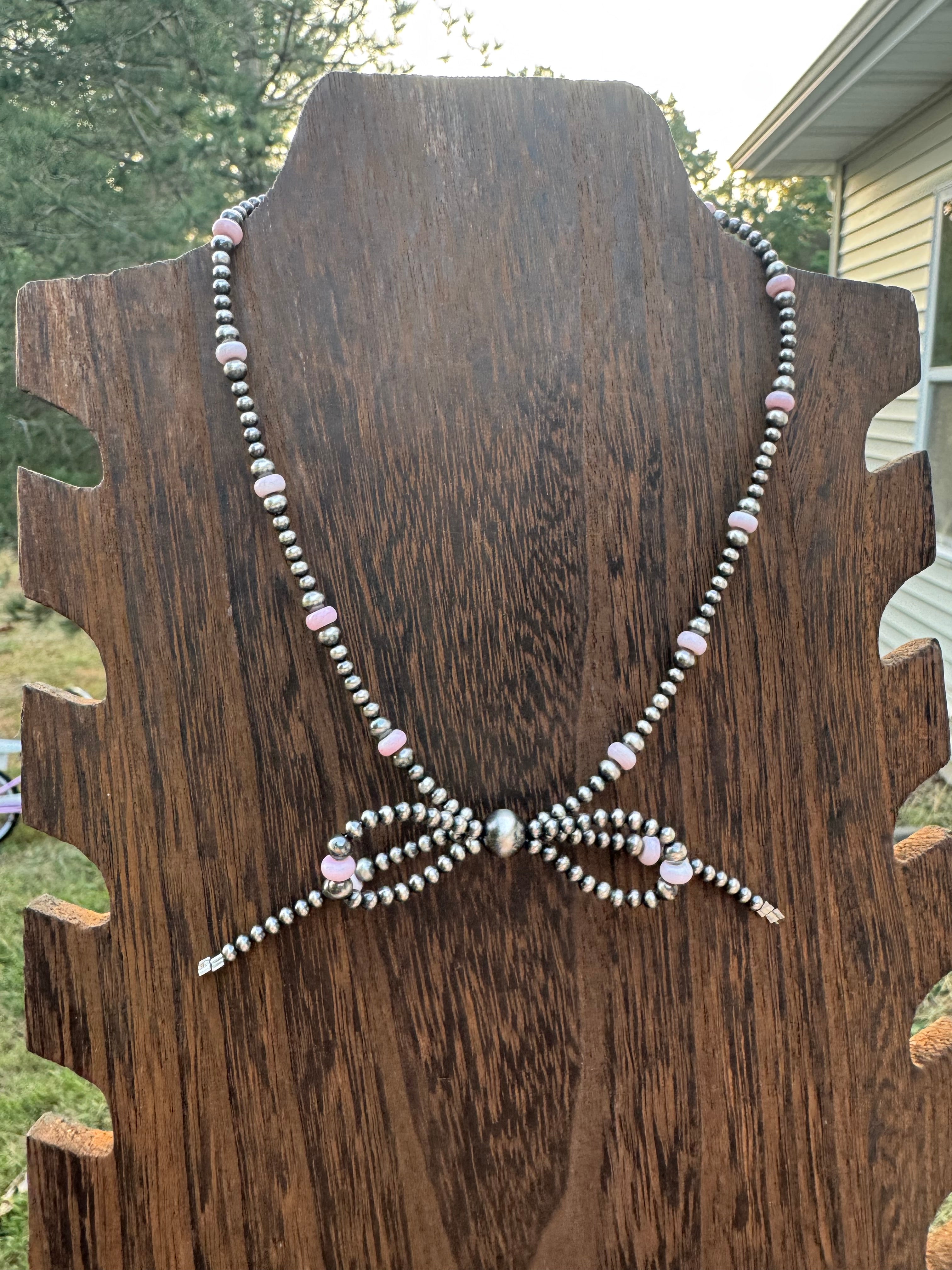Pink conch bow necklace