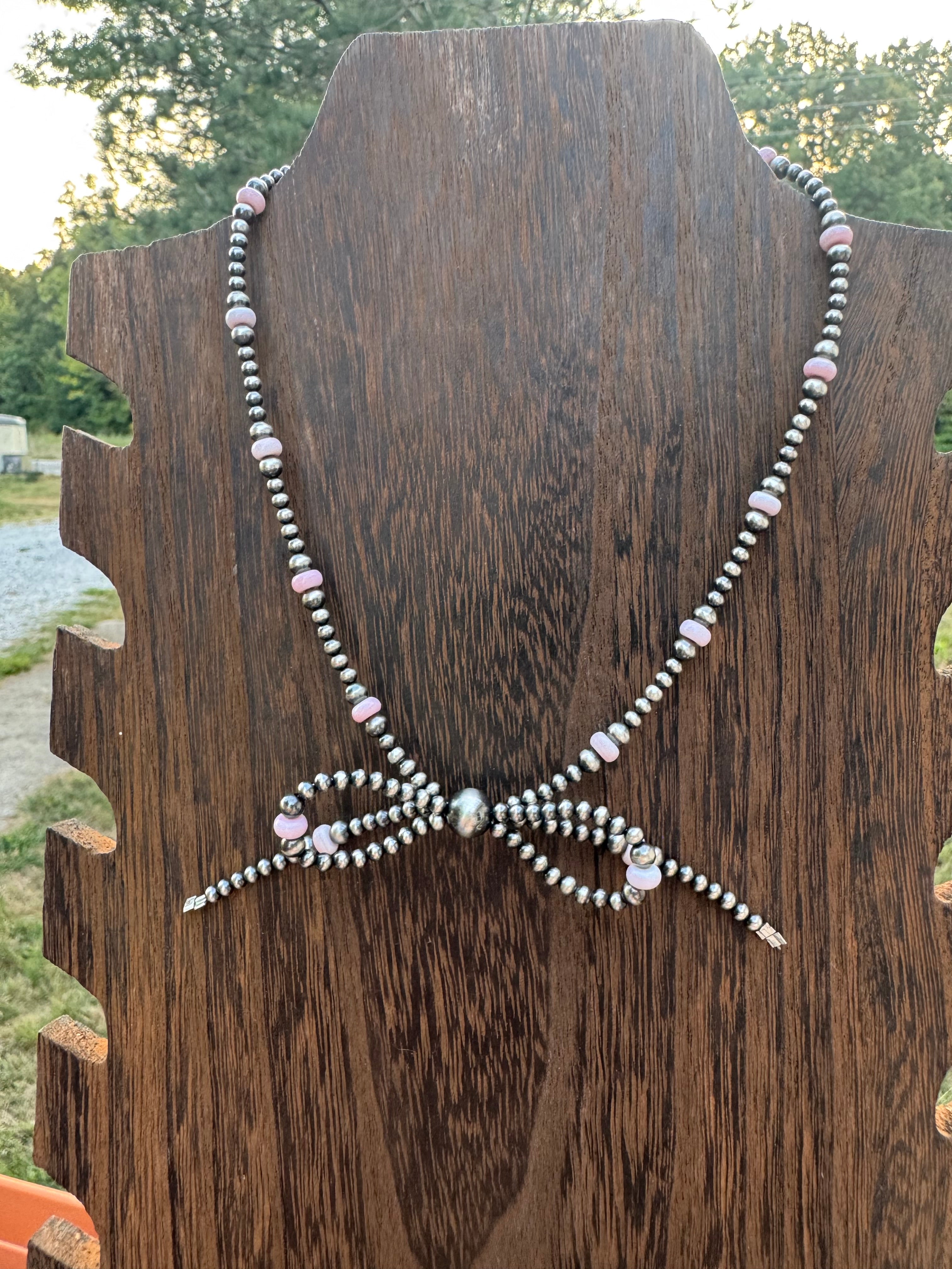 Pink conch bow necklace